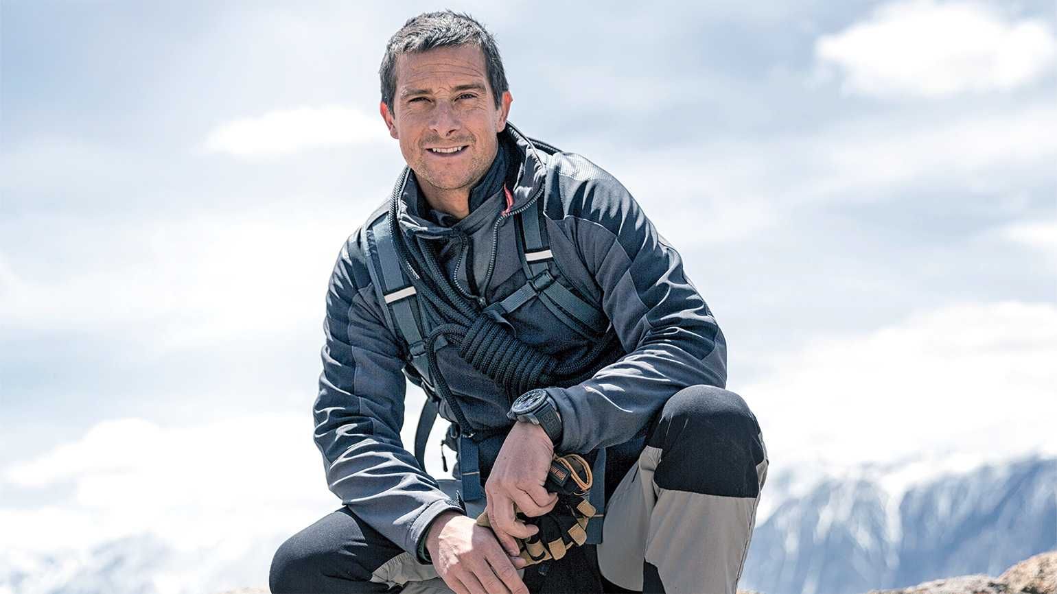 Bear Grylls on a mountain sharing where to pray