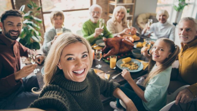 Family gathering together for a feast.